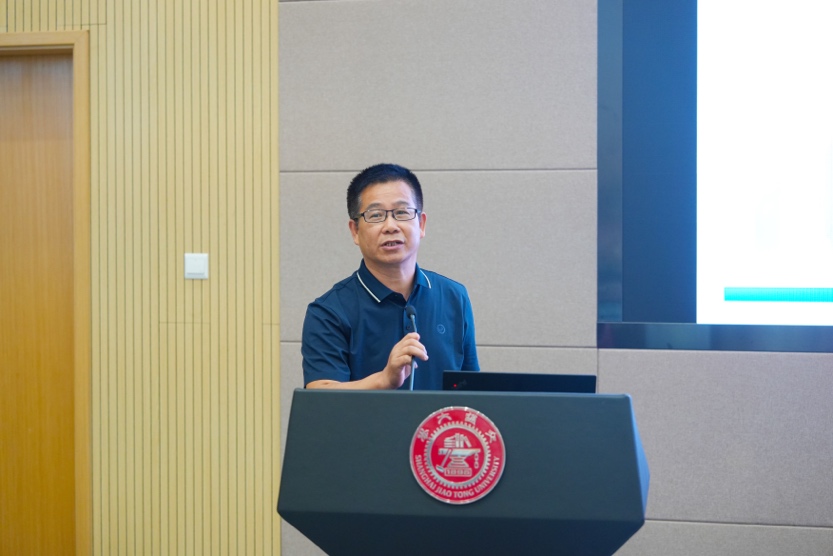 A person standing at a podium
Description automatically generated